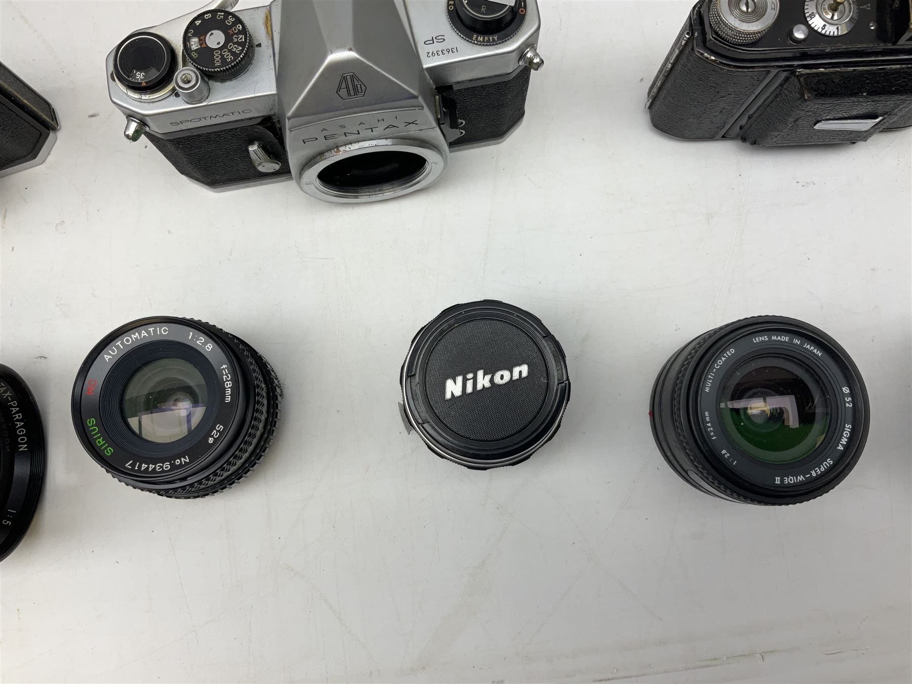 Collection of camera bodies and lenses, to include Contax 159mm, Pentacon FM, Miranda EE, Canon EXee, Praktica IV FB, 'Photax-Paragon 1:5 f=300mm no.312703' lens, 'Sirius MC Automatic 1:2.8 f=28mm, 52 No.934417 etc