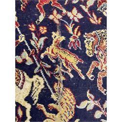 Persian indigo and crimson ground hunting rug, the filed decorated with hunters on horseback (205cm x 132cm); together with a small Afghan Bokhara rug (111cm x 79cm)