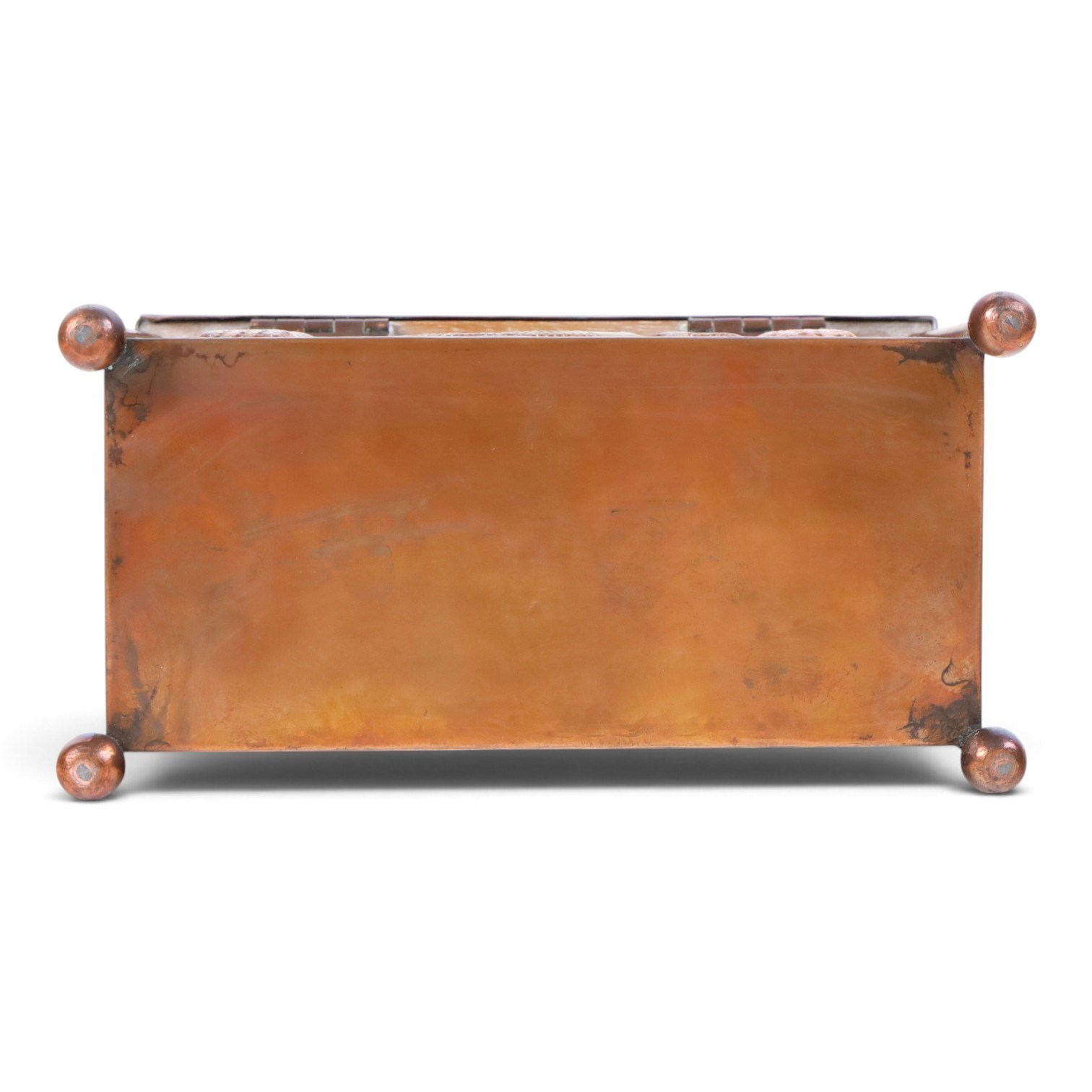 Art and Crafts copper and brass hammered casket, of rectangular form with repoussé decoration of dolphins, in the manner of  John Pearson, H10cm L19cm