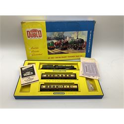 Hornby Dublo - two-rail set 2021 'The Red Dragon ' passenger train W.R. with Castle Class 4-6-0 locomotive 'Cardiff Castle' No.4075 and two coaches (no track), boxed with paperwork, Red Dragon headboard and oil tube; and two-rail set 2006 Tank Goods Train set with Class R1 0-6-0 tank locomotive No.31340 and two open wagons (lacking guards van) and track, boxed with instructions (2)