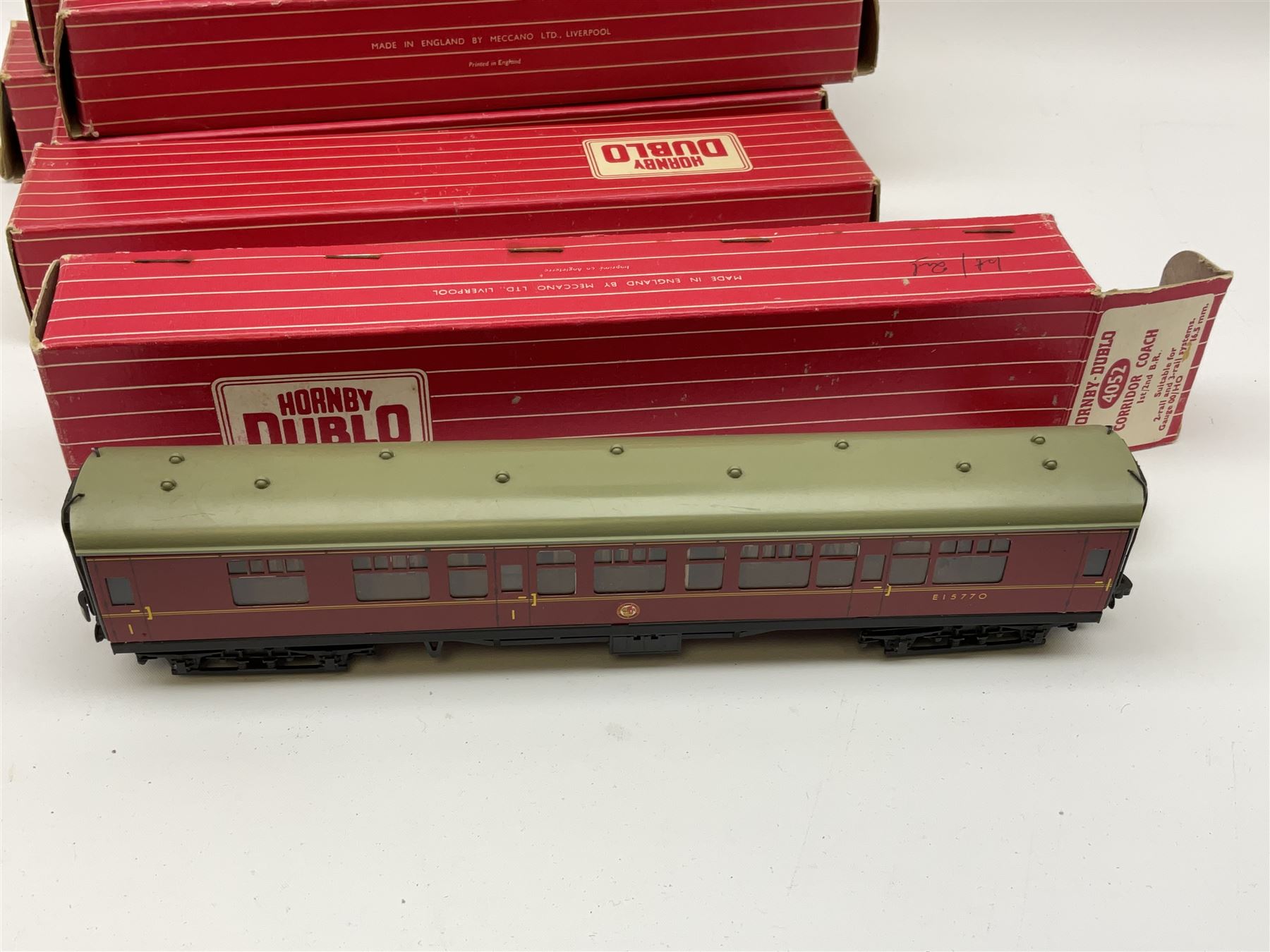 Hornby Dublo - eight coaches comprising 4047 Composite Restaurant Car W.R. (D20); 4049 Composite Restaurant Car B.R. Maroon; 4052 Corridor Coach 1st/2nd B.R.; 4061 Open Corridor Coach 2nd Class W.R.; 4062 Open Corridor Coach 1st Class B.R.; 4063 Ope Corridor Coach 2nd Class B.R.; and two 4078 Composite Sleeping Car B.R.; all in boxes (8)