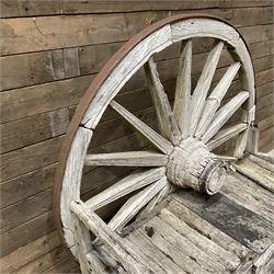 Early 20th century timber framed cartwheel garden bench