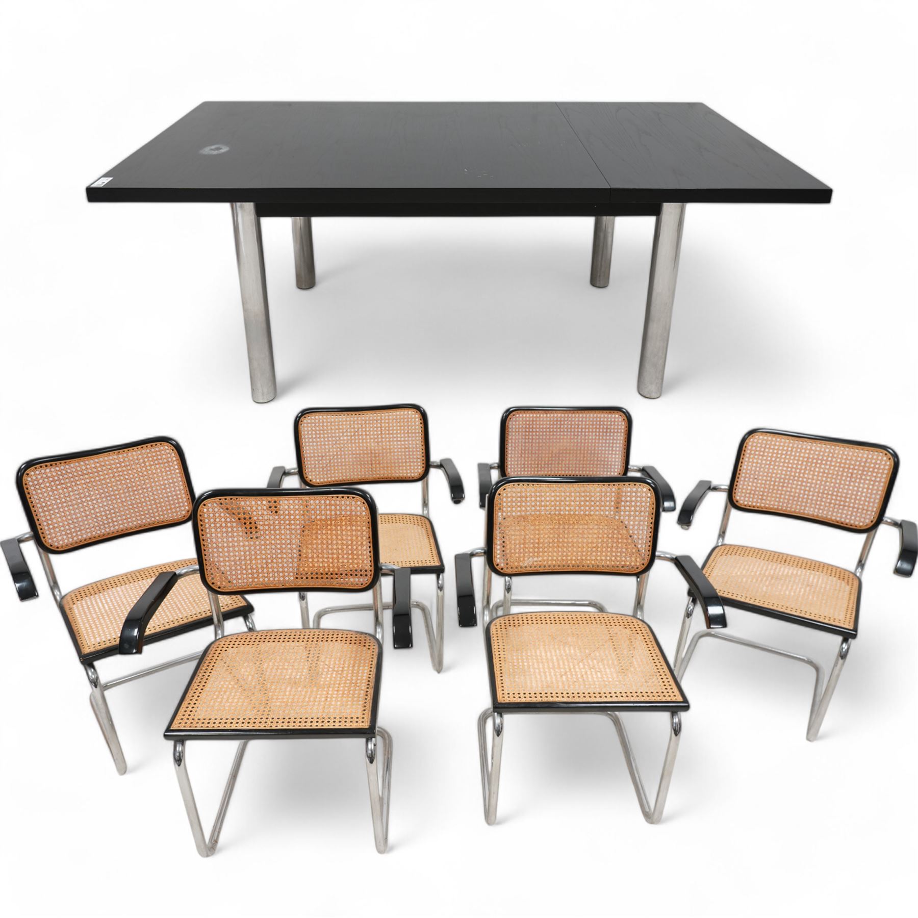 Retailed by Habitat - after Marcel Breuer - set of six 'Cesca' elbow chairs, on chromed supports with cane seat and back, in black paint finish (W62cm, H84cm, D50cm); together with a rectangular extending dining table, sliding top with drop leaf, on chromed supports (194cm x 90cm, H74cm)