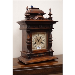  Victorian walnut architectural cased mantel clock, square dial marked Junghans, twin train movement striking the hours on a gong, H50cm   