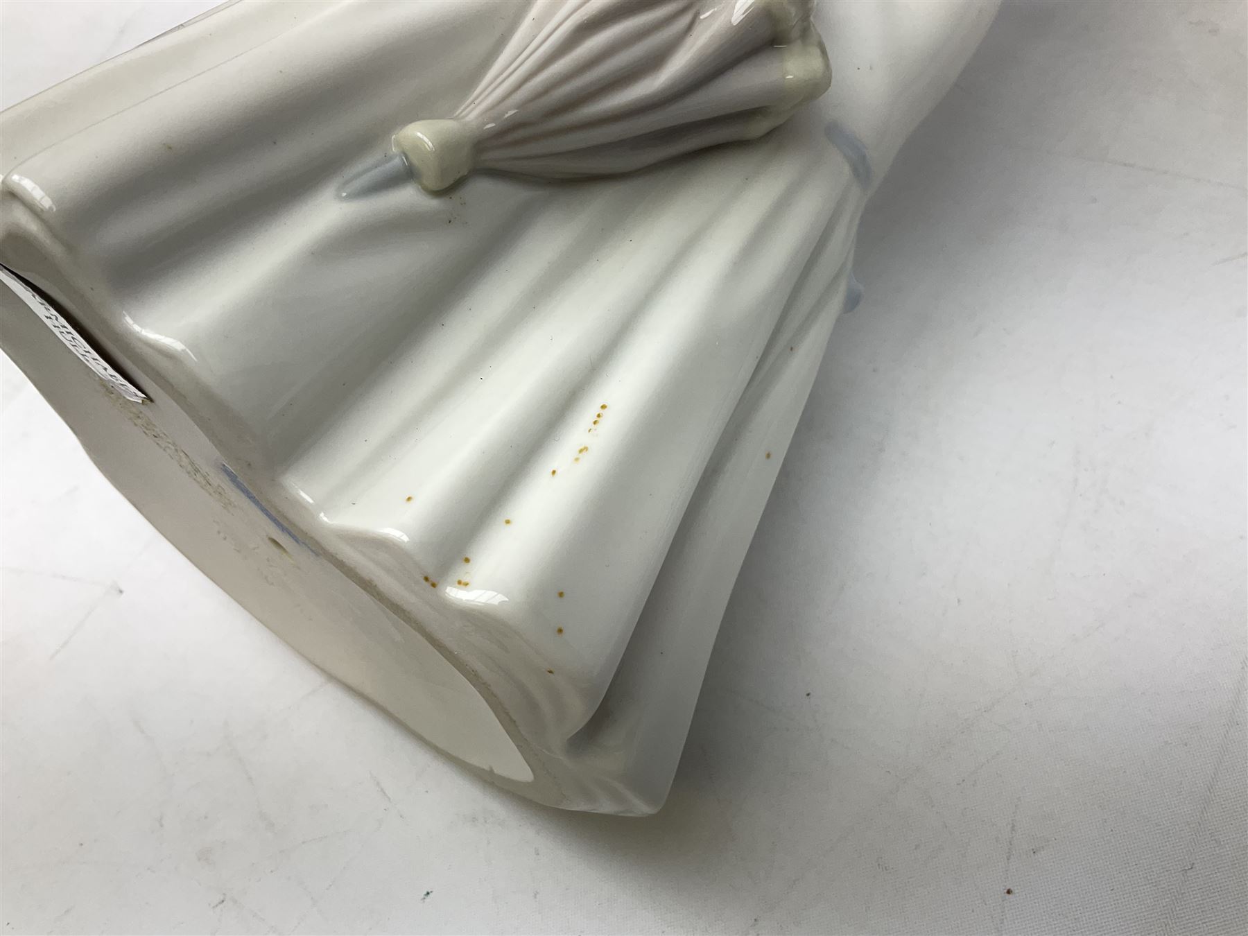 Lladro 'Walk With the Dog' figure no. 4893, together with Lladro swan figure, Porceval figure of a gentleman with a bird perched upon his hand and a further of a lady with flowers beside a basket, all with marks beneath, tallest H40cm