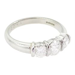 Platinum three stone round brilliant cut diamond ring by FEU, London 2003, total diamond weight 1.03 carat