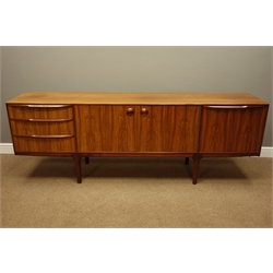  1970s 'A.H. McIntosh & Co' rosewood sideboard, three drawers, cupboard and fall front compartment, W214cm, H75cm, D45cm   