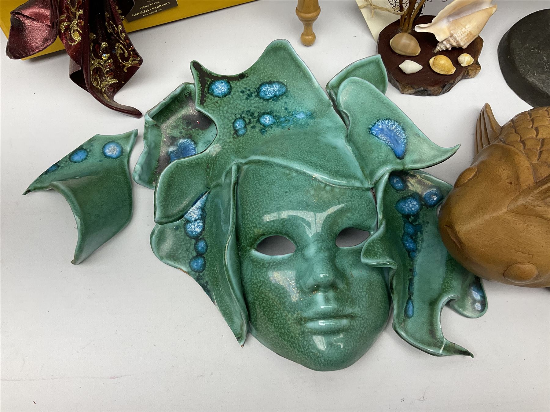 Kennedy 1964 silver half dollar, together with other American coins, bronzed figure of a young boy water carrier with yoke and brass pails, Green man wall mounted head, carved wood fish and Venetian masks etc