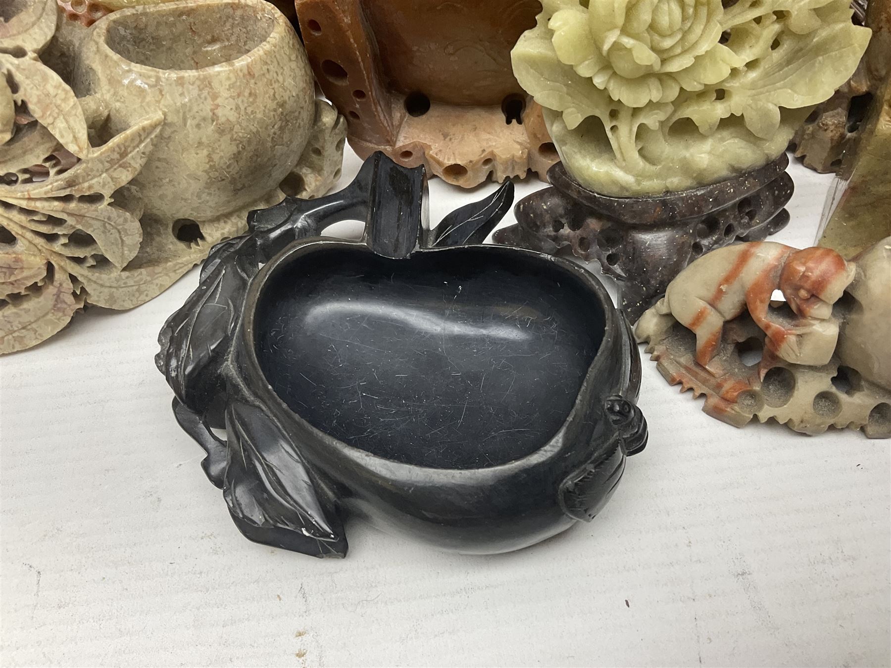 Collection of hardstone and soapstone, including hardstone seal carved temple dogs finial, inscription on base, together with inkwells, vases etc  