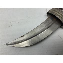 Omani Khanjar dagger, the 12.5cm curved blade with pronounced medial rib to either side, waisted horn style hilt with dome shaped pommel and inlaid pique work; in an intricately filigree decorated white metal scabbard with rings woven into the belt mount L25cm overall