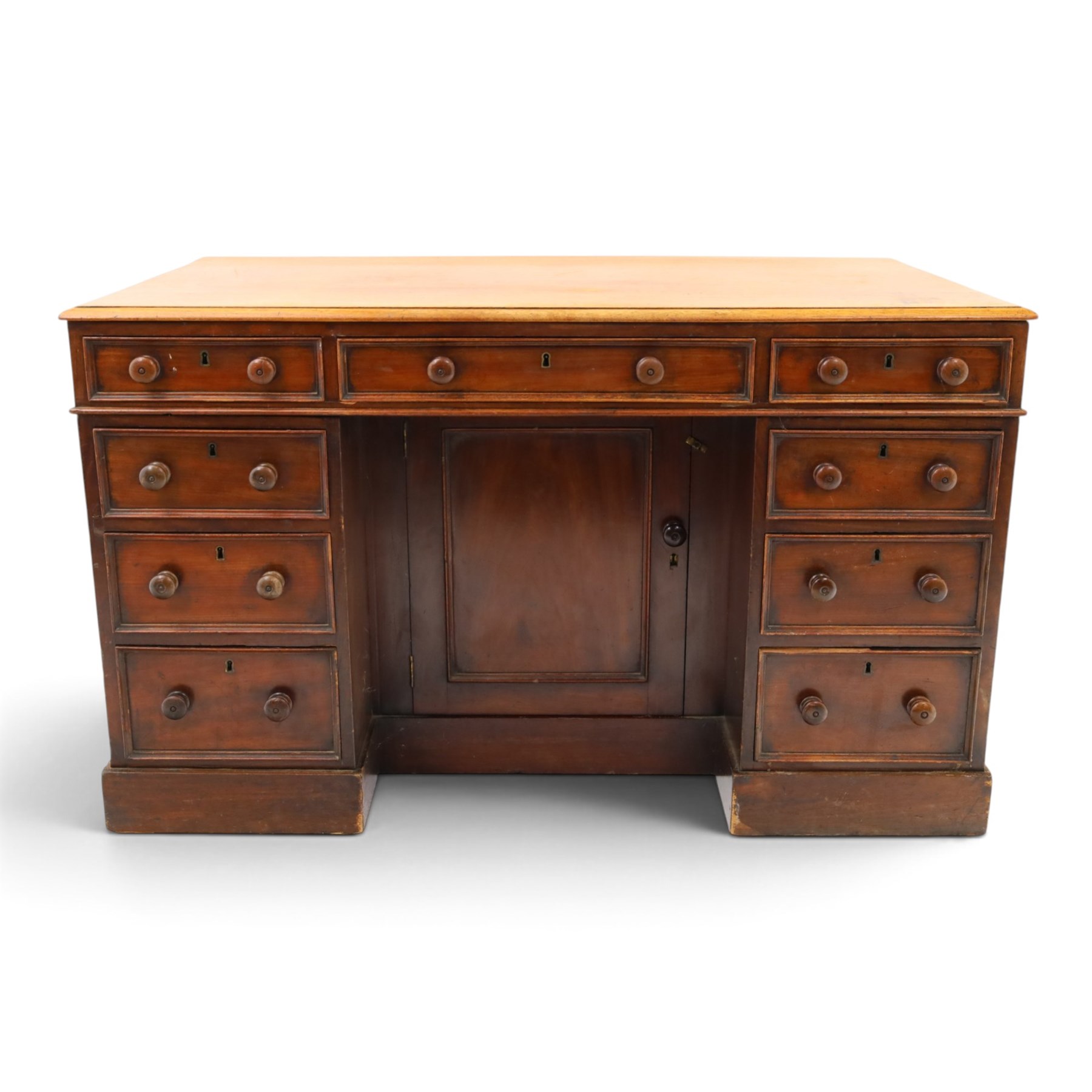 Victorian mahogany kneehole desk, rectangular top fitted with central frieze drawer over recessed cupboard, flanked by four graduating drawers to each side, on skirted base