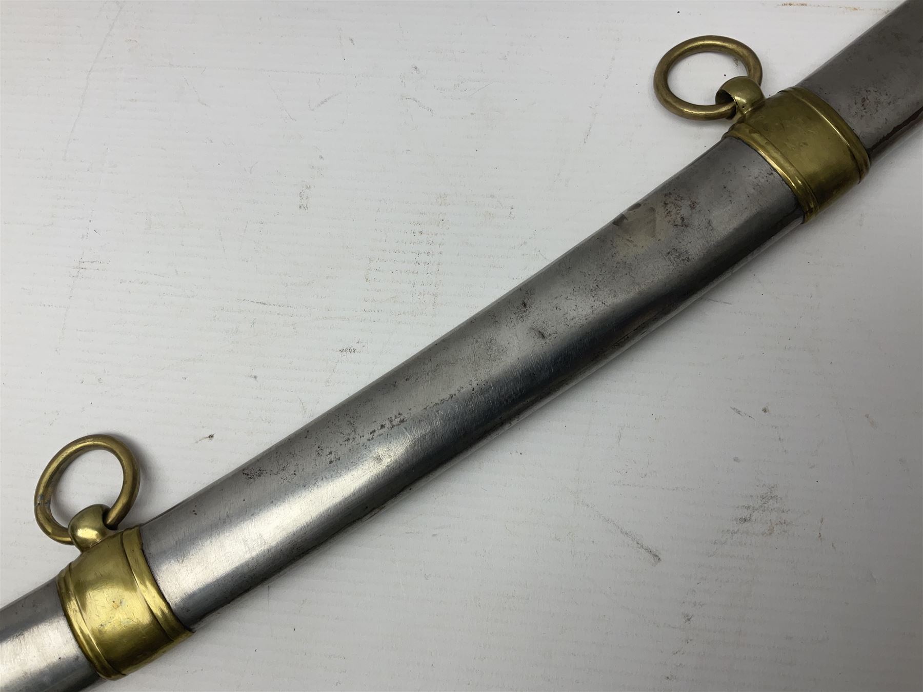 Early 19th century French Lancers officer's sword c1810, the 84cm curving fullered blade retaining most of its bluing, gilding and engraved decoration, inscribed I.S.& C. to ricasso (for Schimelbusch), brass three-bar hilt with elongated elliptical langets and wire-bound leather grip; in polished steel scabbard with two brass suspension rings L100cm overall