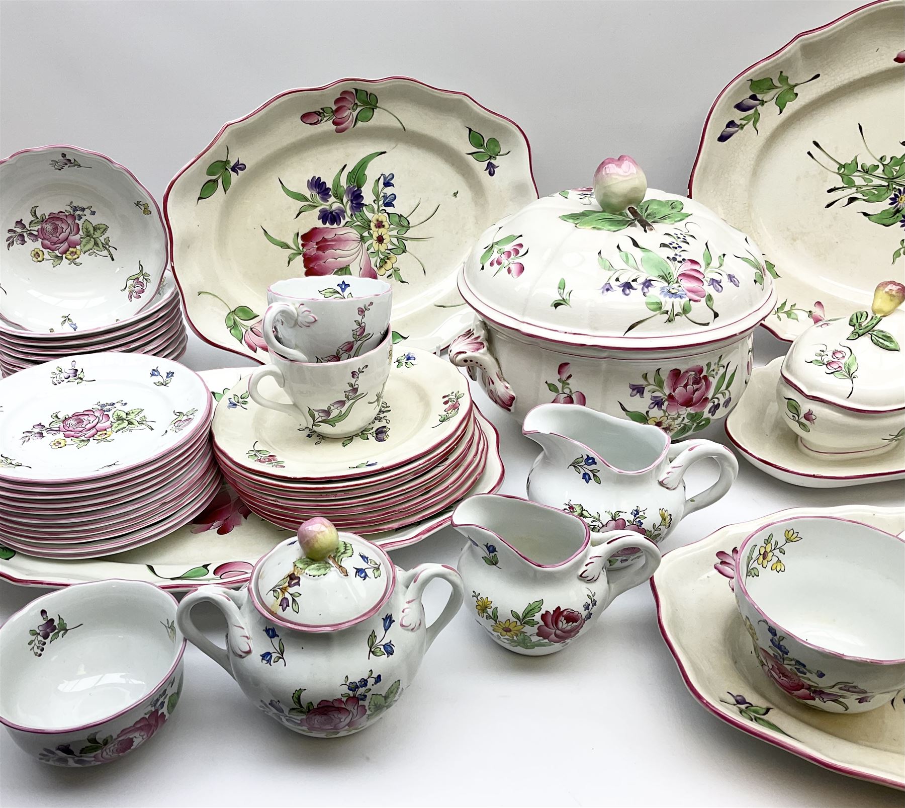 Matched Copeland Spode, Spode and French Luneville and Marlborough Sprays pattern dinner and tea wares, comprising two tureen and covers and apple finials, two sauce tureen and covers with pear finials and fixed stands, six graduated platters including two pairs, large plate, thirteen dinner plates, twelve bowls, ten smaller bowls, eight side plates, eleven smaller side plates, teapot, twin handled sucrier and cover with apple finial, open sucrier, cream jug, smaller cream jug, four breakfast cups, eight tea cups, four large saucers, eleven smaller saucers, and nine further smaller saucers. 