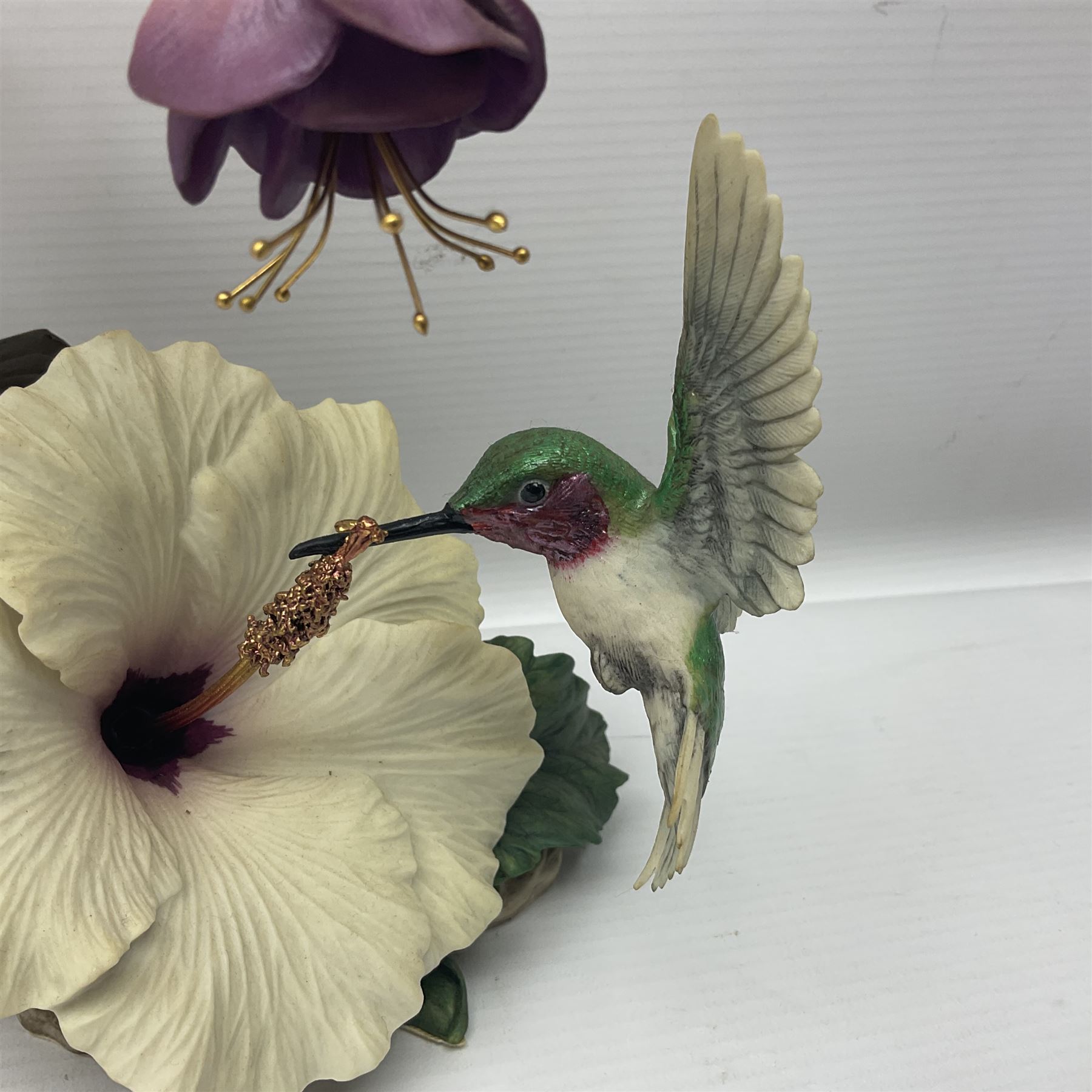 Franklin Mint House of Faberge, four humming bird figure groups, comprising Flight of Fancy, Beauty in Bloom, Splendor in the garden and The Enriched Garden, largest H35cm