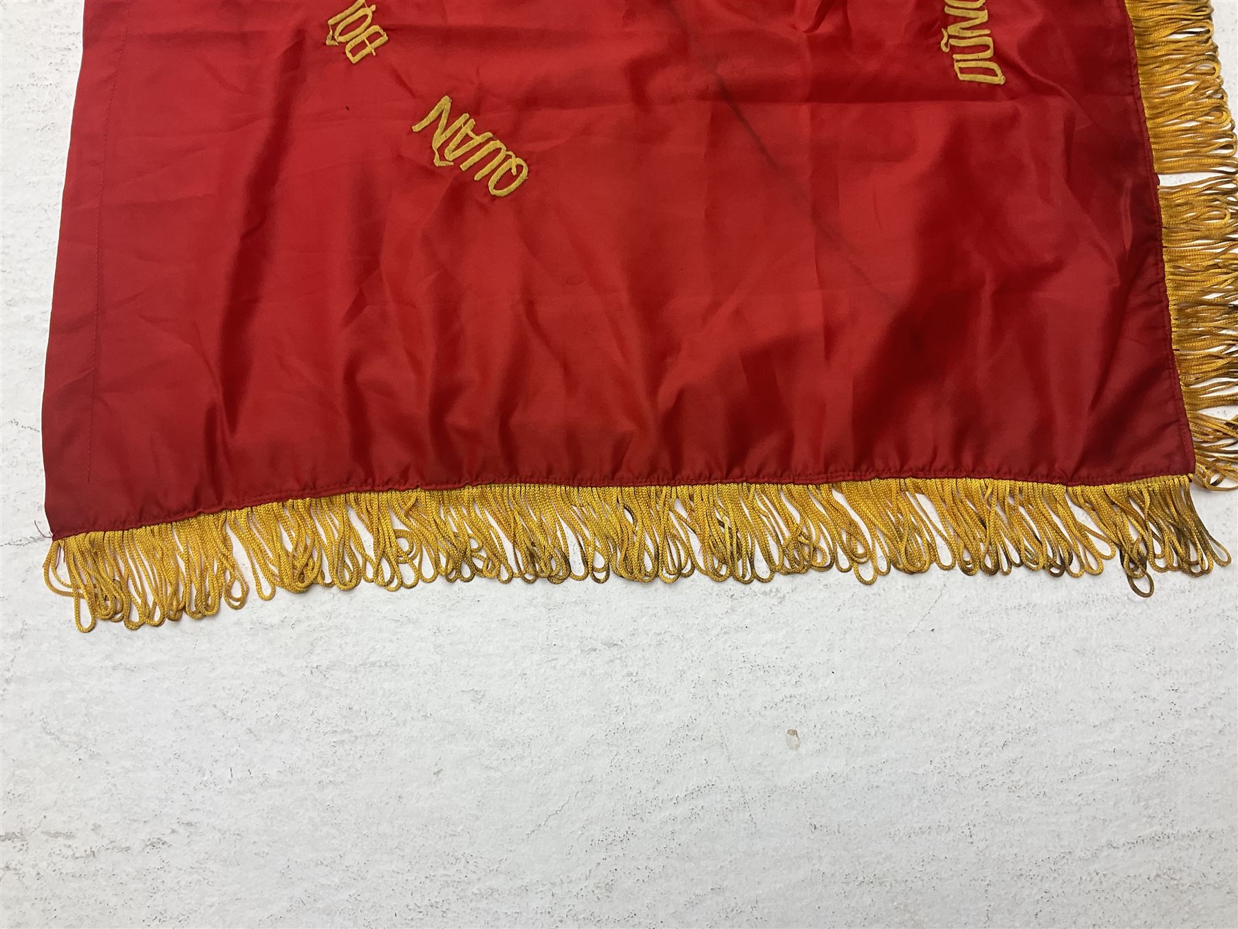 1960s North Vietnam banner embroidered in yellow thread on a red ground, roughly translates as 'Peoples Army of Viet Nam. Warriors of Viet Nam Determined To Keep The Country 1964' around a central military crest with the motto 'Warriors Keep The Country'; tassels to three sides 70 x 100cm