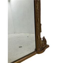 19th century gilt wood and gesso framed overmantel mirror, the leaf moulded upper rail mounted by sitting putto within a laurel leaf wreath, foliate egg and dart moulded slip, plain mirror plate