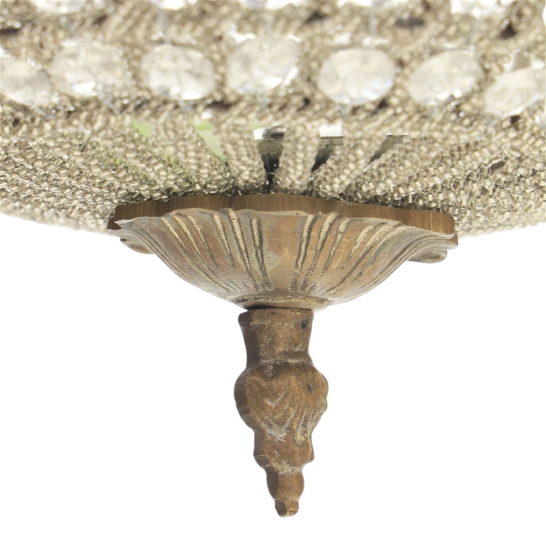 Late 19th century pair of French Empire gilt metal and cut glass bag chandelier, the tapering body formed of faceted glass button drops, with lobed lower bowl, cast foliate and mask mounts, surmounted by a bulbous upper section and terminating with a pendant finial