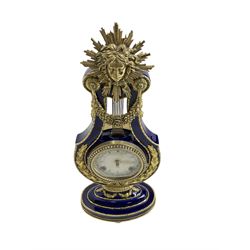 20th century V&A Marie Antionette lyre clock - Blue porcelain with gilt mounts on a  oval stepped base, dial with roman numerals and gilt hands, continental twin train spring driven movement sounding the hours and half hours on two bells. With key.