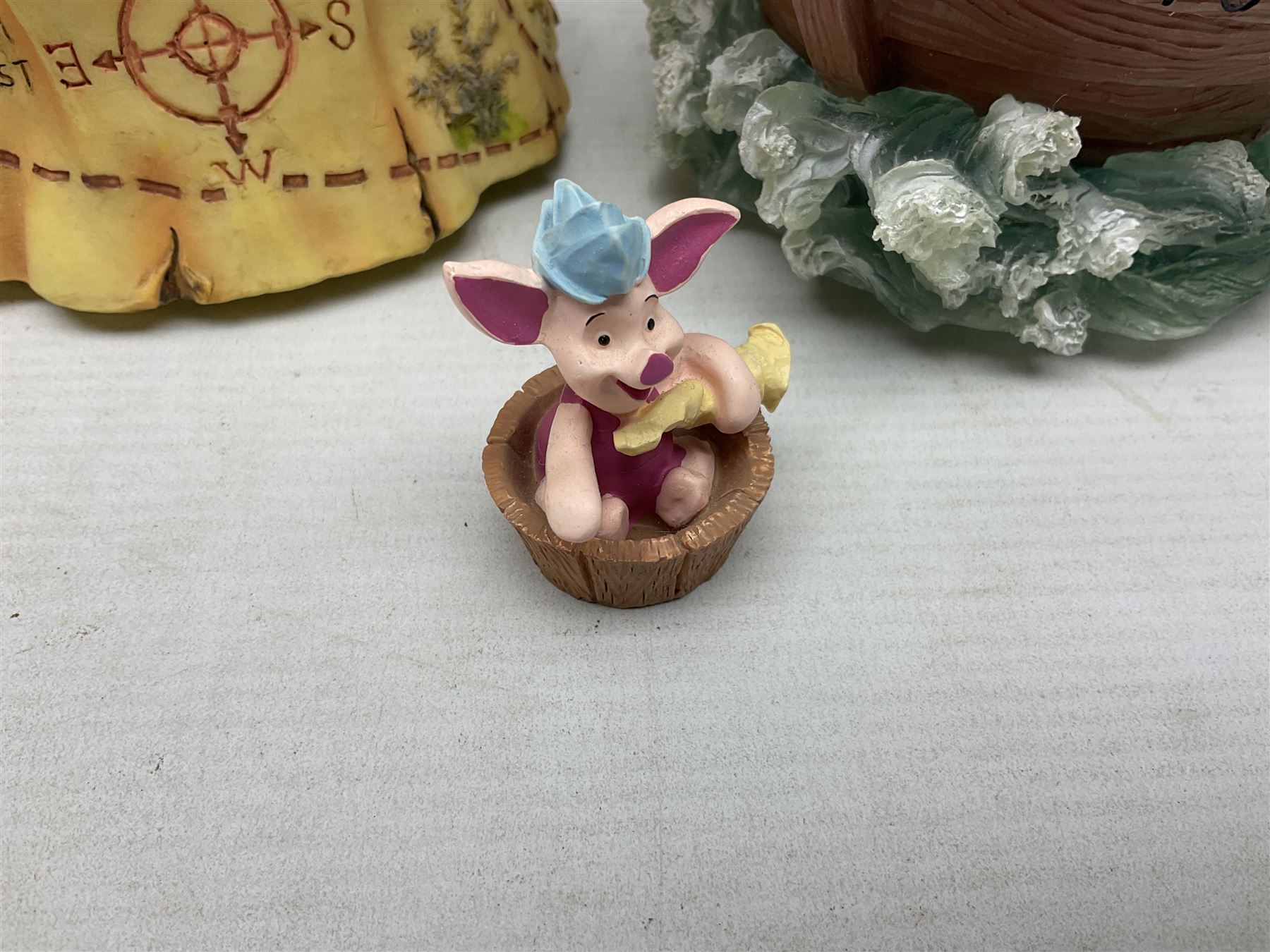 Five Disney Winnie The Pooh snow globes, to include Pooh and Piglet Sailing, Pooh's Grand Adventure and Blustery Day, together with The Walt Disney Classic Waterglobe collection globe and group Tigger, Winnie and Piglet figure under dome, all with boxes (7)