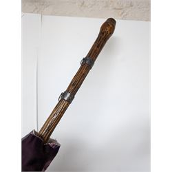 Pull along wicker basket on wheels, with cane handle, together with a silver mounted wooden umbrella and a one other umbrella, basket inlcuding handle H103cm