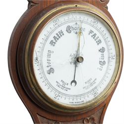 Aneroid barometer and thermometer in carved oak case