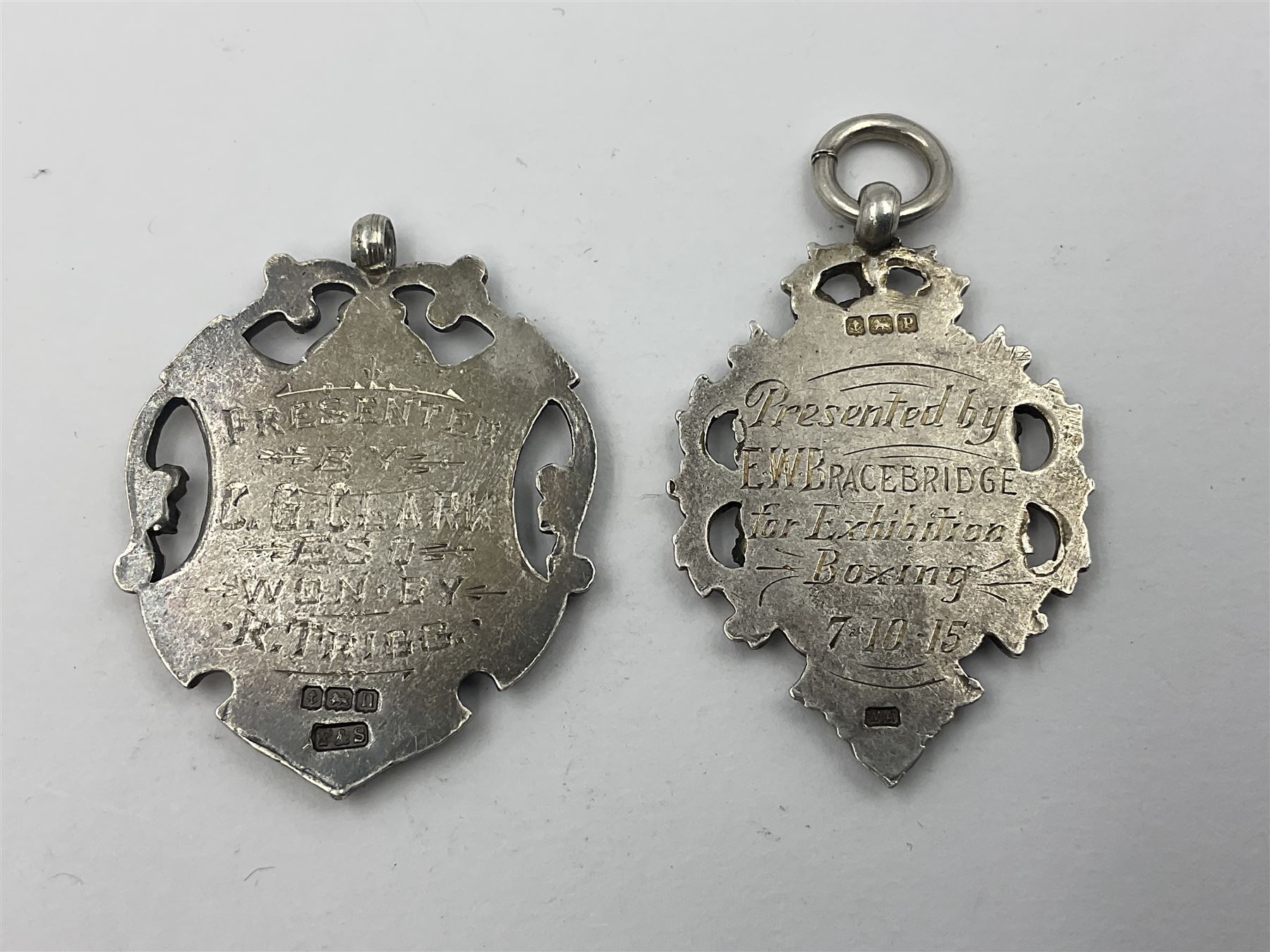 Seven Edwardian and later silver cartouche fobs, to include five gold faced examples and three double sided examples, all hallmarked with various dates and makers
