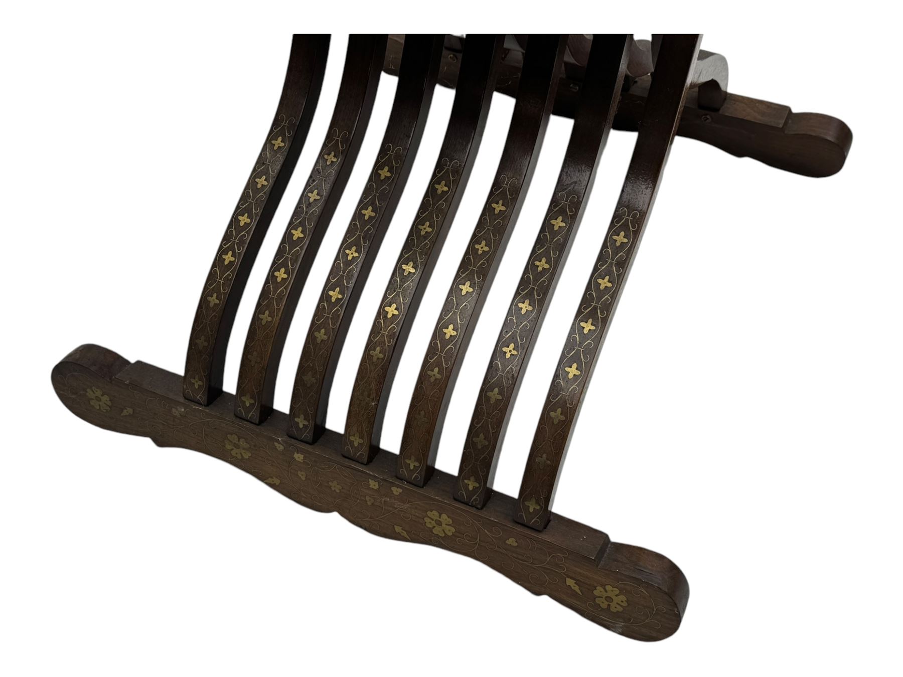 Late 20th century brass inlaid hardwood throne chair, curved X-frame form, raised shaped back inlaid with trailing leafy branches and flower heads, on sledge feet 