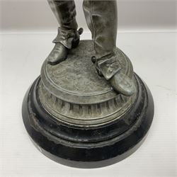 Spelter figure modeled as Cavalier with a raised sword, upon a circular base, H52cm
