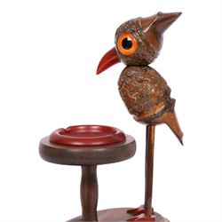 Henry Howell & Co., YZ bird novelty smokers stand, circa 1920-30's, with novelty nut bird with Bakelite beak and tail, with removable Bakelite ashtray on raised wooden plinth, with match holder and striker to the base, stamped YZ TRADE MARK MADE IN ENGLAND to base, 23cm, L21cm  