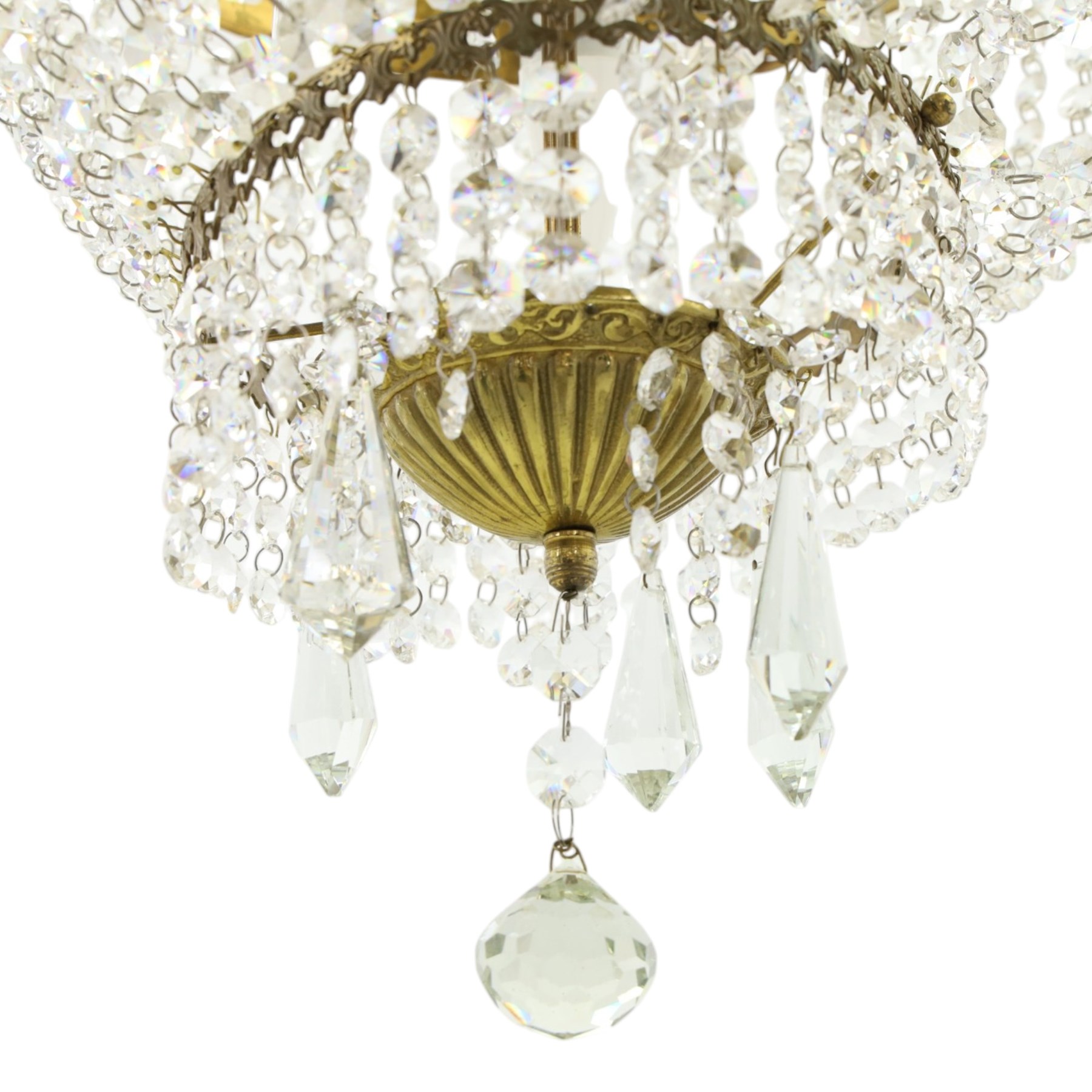 Empire design brass and crystal chandelier, the two circular brass tiers with foliate mounts, connecting the cascading crystal garlands, with prismatic drops