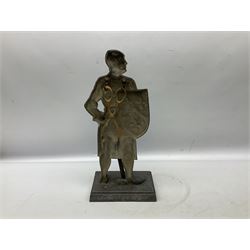 Cast iron fire companion set modelled as a knight in armour with fleur-de-lis shield and sword concealing fire poker, with brass tongs to reverse, raised upon stepped rectangular base, H55cm