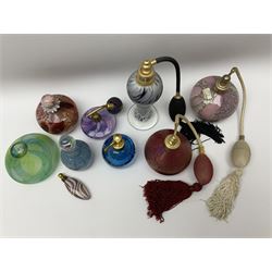 Art glass atomisers to include a Royal Brierley bottle of typical form with mottled iridescent decoration and signed to base, a blue scent bottle with trailed swag decoration, probably Sanders and Wallace, signed 'S and W' beneath, and six other art glass perfume bottles with of various forms with swirled designs and captured bubble decoration