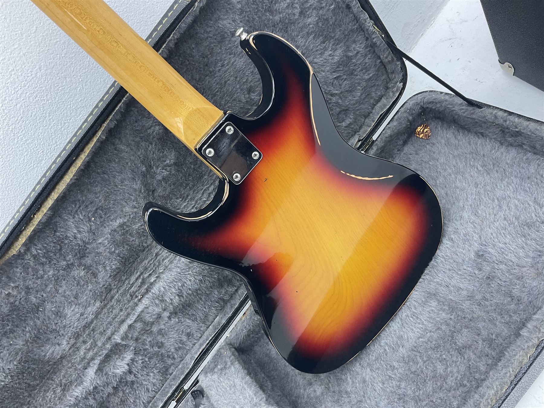 Fender style sunburst electric guitar with manuscript mark 'Zenta Stratocaster 1963' L97cm; in hard carrying case; another similar unmarked sunburst electric guitar; in gig bag; and Fender Frontman Amplifier, serial no.M473406 (3)