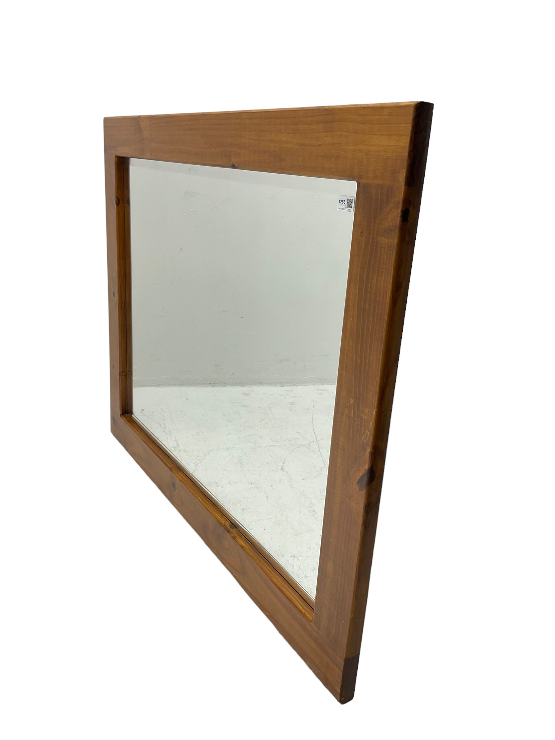 Large pine framed wall mirror, rectangular bevelled plate