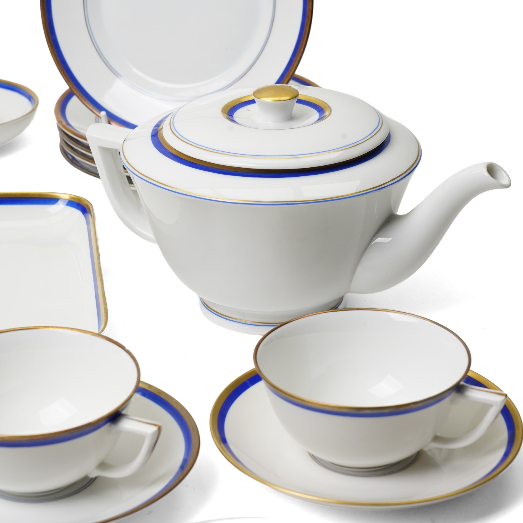 Royal Copenhagen mid-20th century tea service decorated in blue and gilt comprising ten teacups, ten saucers, ten side plates, two triangular serving plates, two square serving plates, teapot, milk jug and covered sucrier 