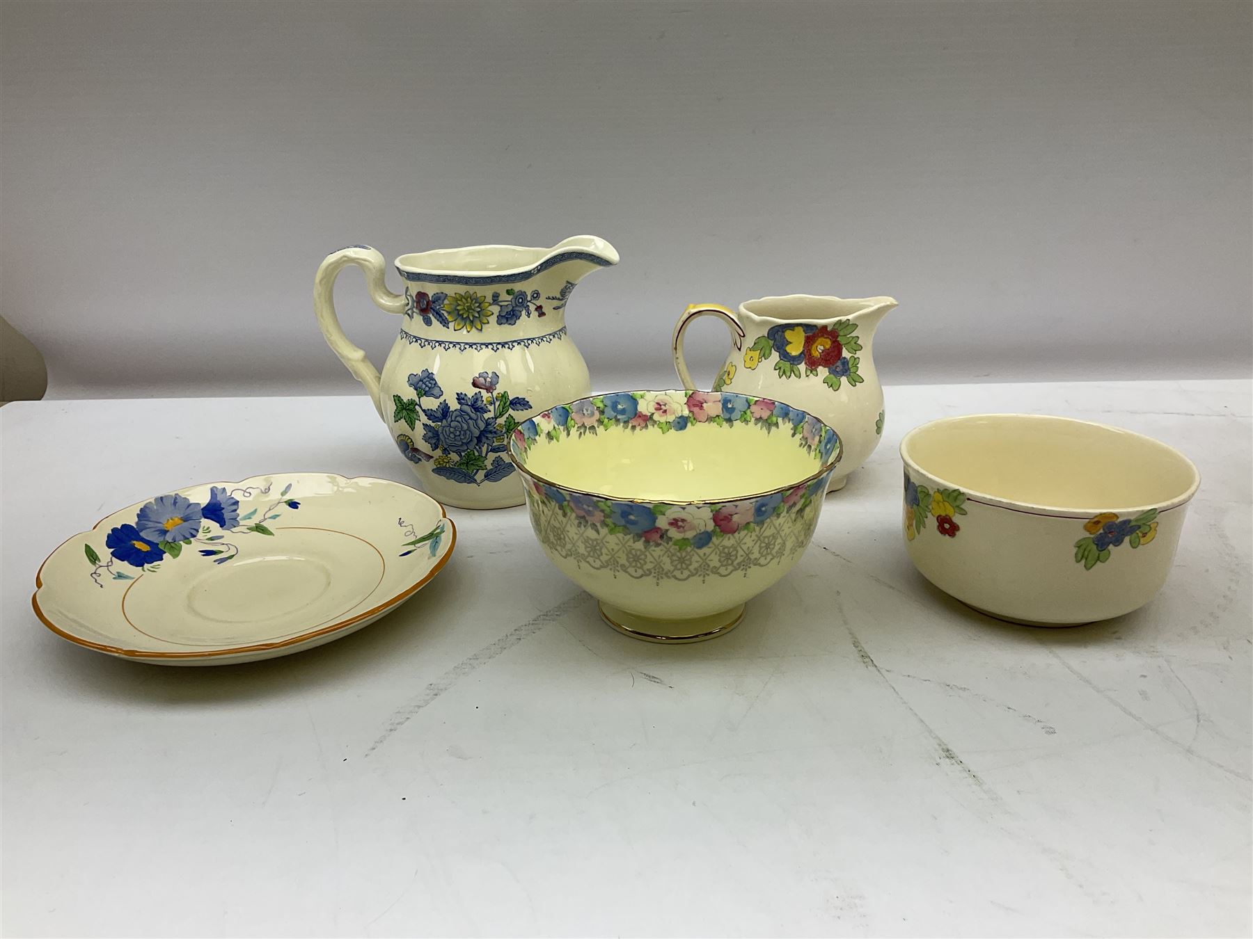 Group of ceramics to include Art Deco examples, Arthur Wood twin handled vase decorated in the Garden Wall pattern, Art Deco style Coalport twin handled lidded sucrier and saucer, Mason's Applique jug (scratch through mark), Royal Doulton Minden bowl and jug, Copeland Spode Royal Jasmine jug, Crown Devon, etc