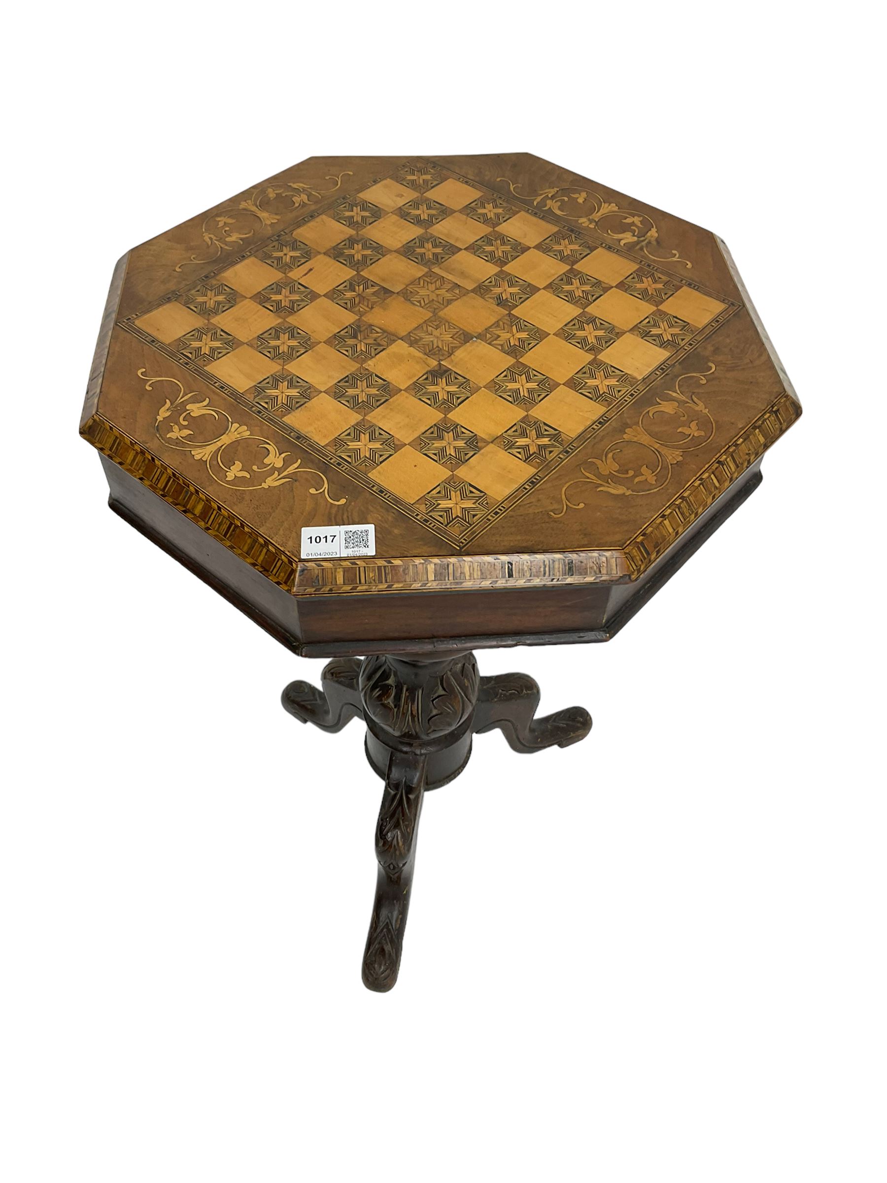 Late 19th century inlaid walnut sewing or work table, octagonal hinged top with satinwood and ebony chessboard inlay, surrounded by foliate decoration, the edges inlaid with crossbanding and stringing, fitted interior with chess pieces, raised on baluster pedestal carved with acanthus leaves on a tripod base 