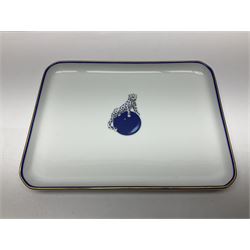 Limoges for Cartier, ceramic trinket dish, of rectangular form with rounded corners, decorated to centre with leopard upon a blue ball, with blue and gilt rim, with printed mark beneath, in original box, H15.5cm, W21cm