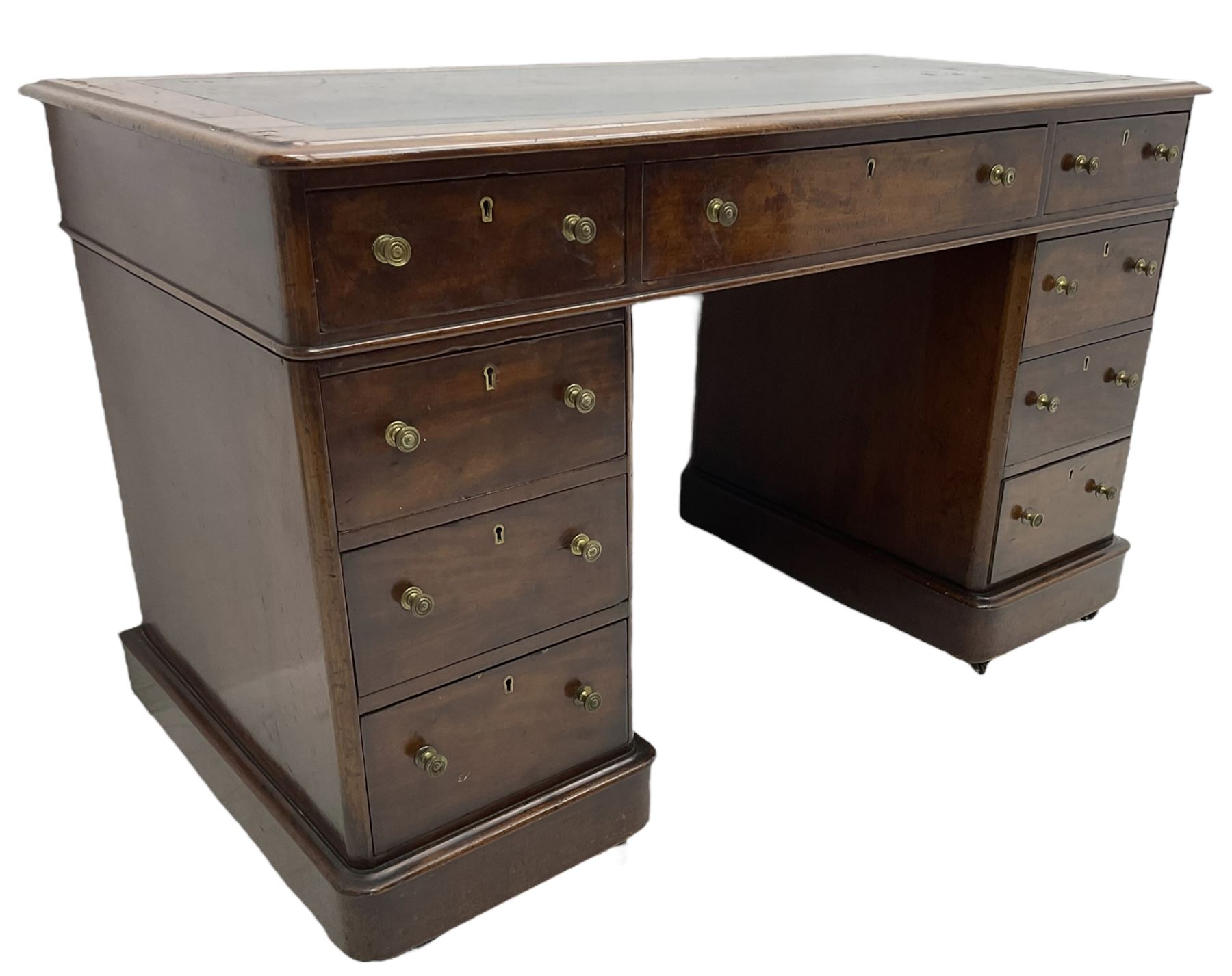 Victorian mahogany twin pedestal desk, rectangular top with inset ebonised leather writing surface, fitted with nine graduating drawers with brass pull handles, on plinth bases
