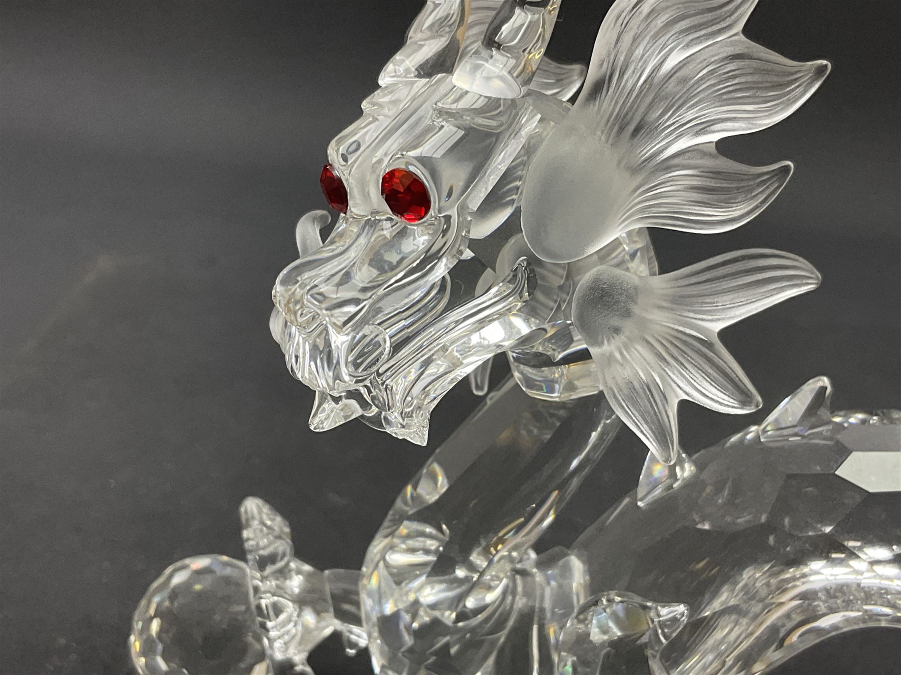 Two Swarovski Crystal Signs of the Zodiac figures, comprising horse and tiger, together with Zodiac dragon holding the flaming pearl, largest H11cm 
