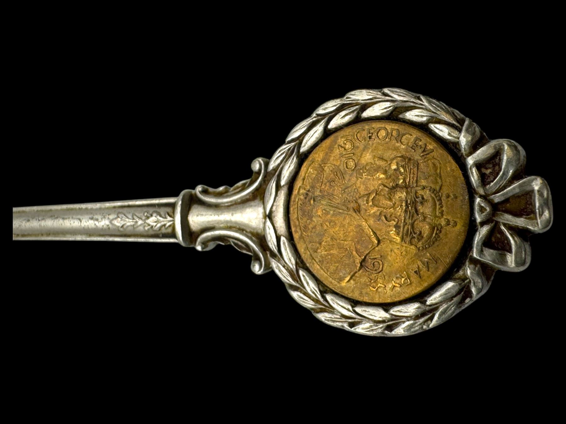 Three silver decanter labels and a collection of silver and silver plated cutlery