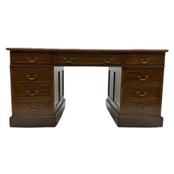 Edwardian mahogany twin pedestal desk, fitted with nine drawers, inset leather writing surface, panelled sides