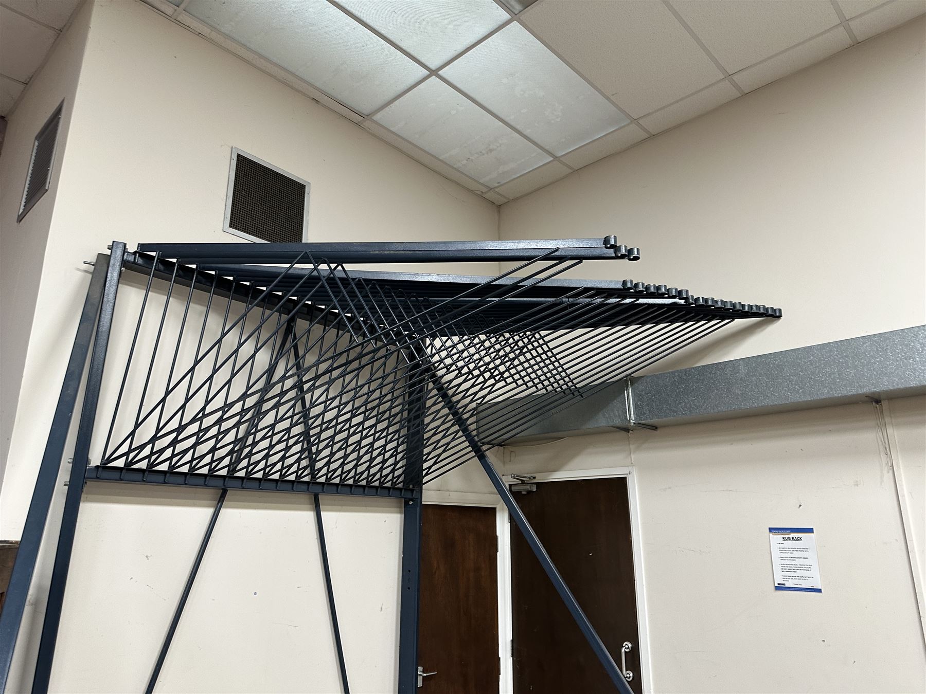 Commercial Rug Display Rack, painted steel, 20 swing arms, can fit 40 rugs back to back