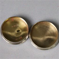 Two early 20th century silver pill/patch boxes, together with two glass perfume bottles with silver overlay and stoppers, all stamped or hallmarked, smallest box D2cm, largest bottle H7cm