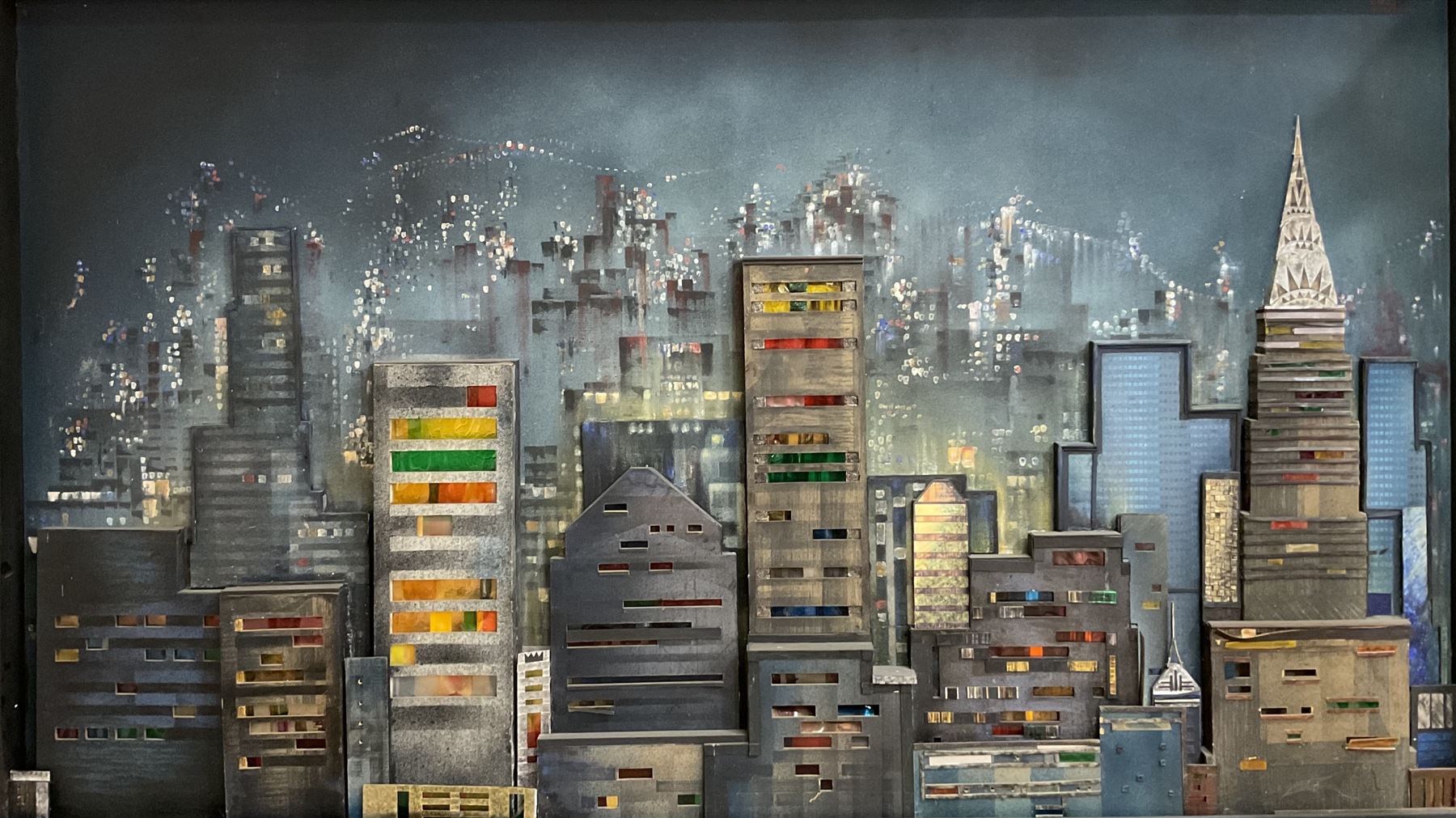 Dennis Clegg (Scottish 1929-): 'New York Skyline', illuminated oil on 3-D wooden construction with perspex and paper signed and dated 1963/2000 (the latter date refers to when the artist restored it) 155cm x 250cm overall
Provenance: commissioned by Lanarkshire entrepreneur John Kane in 1963 from the artist who had graduated at Manchester School of Art in 1960 and went on to work as an interior designer for the next 35 years painting in his spare time.