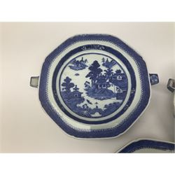 Three late 18th/early 19th century Chinese export hot water plates, of octagonal form decorated with landscape set with pagoda, islands, huts and figure crossing a bridge, within spear head and diaper borders, D23cm