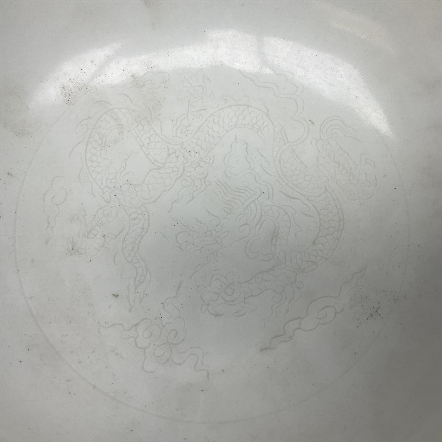 Pair of Chinese famille jaune bowls, decorated in green enamel with a dragon chasing a flaming pearl amongst clouds, upon a yellow ground, the interior decorated to centre with dragon, with six character mark beneath, D17.5cm