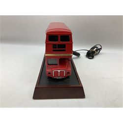 Novelty telephone in the form of a London Routemaster bus, c1997, fitted on wooden plinth with modern connection L25.5cm