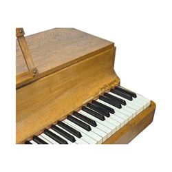 Louis Zwicki - mid-20th century oak cased compact piano, fitted with a folding music rest and full keyboard, dual brass pedals
