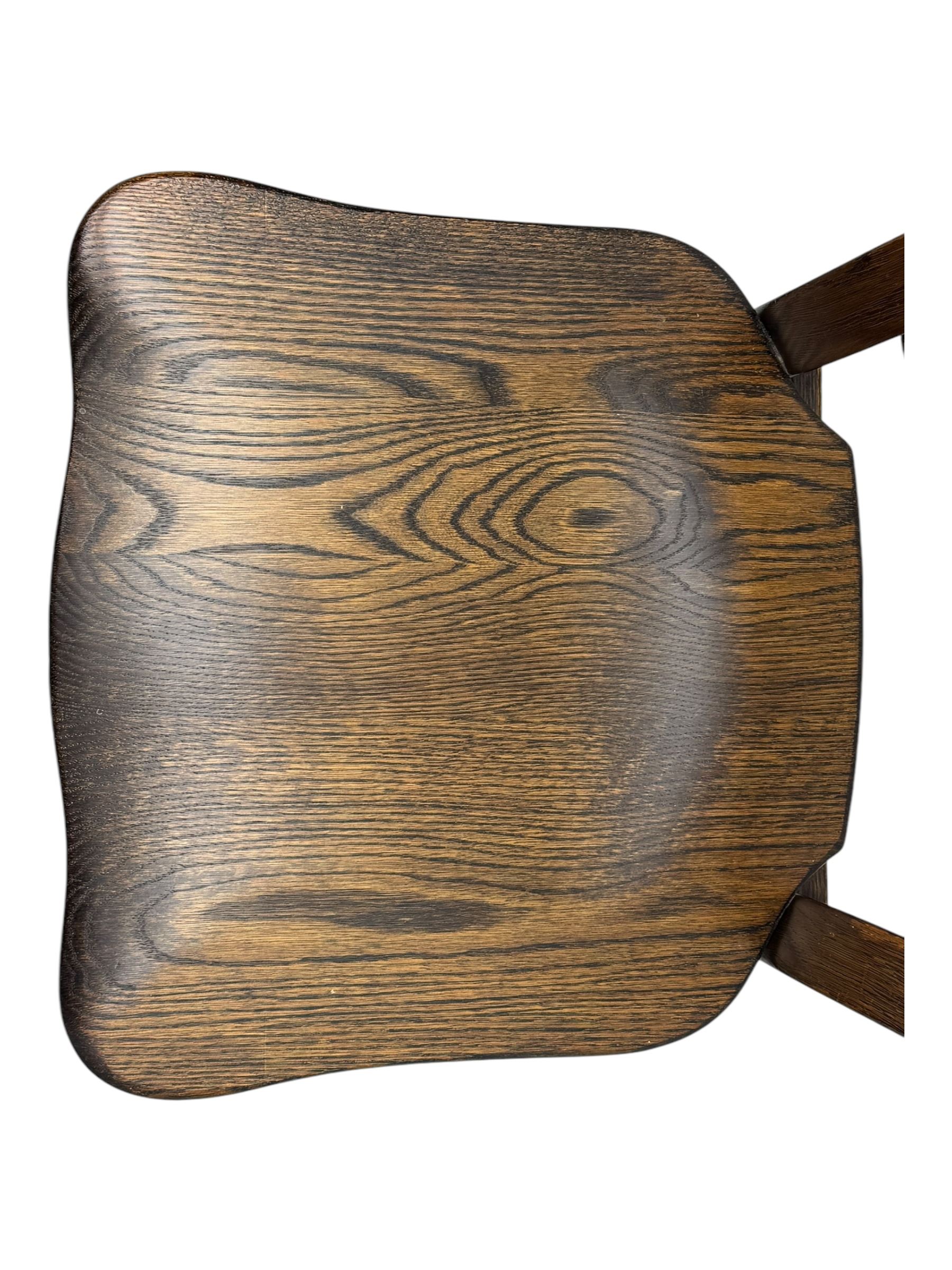 Mid-20th century Dutch oak dining table, rectangular top raised on square supports with tapered sections; four ladderback dining chairs, on turned supports with H-stretchers